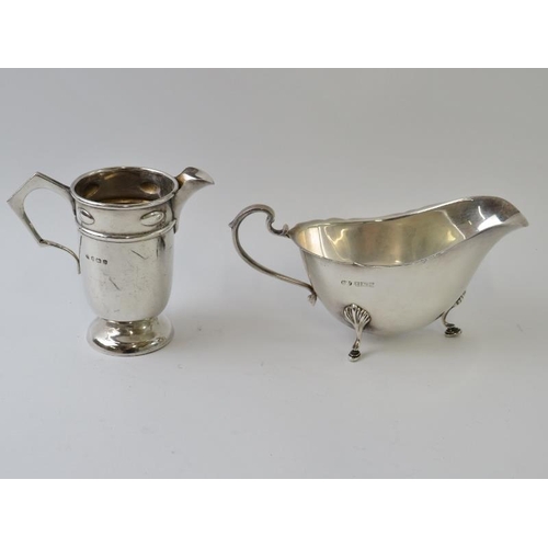 392 - A 1930s Arts & Crafts style silver cream jug, height 8.5cm, hallmarked for Birmingham 1938, maker Wi... 