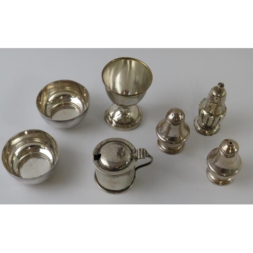 407 - Mixed silver cruets to include a matched salt and pepper, fluted pepperette, pair of plain salts, dr... 