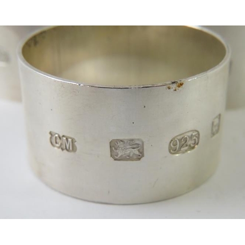 410 - A set of six modernist silver napkin rings bearing 2002 Queen's Golden Jubilee London hallmarks, mak... 