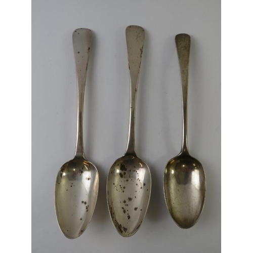 412 - A pair of George III Irish silver table spoons hallmarked for Dublin 1803, maker's mark rubbed, and ... 