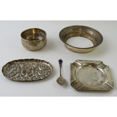 416 - Four hallmarked silver items to include an ashtray, repousse pin dish, small bowl and a stepped stan... 