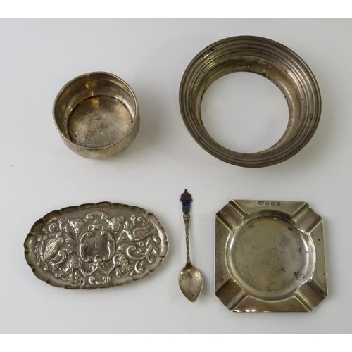 416 - Four hallmarked silver items to include an ashtray, repousse pin dish, small bowl and a stepped stan... 