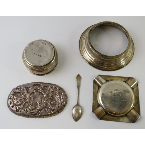 416 - Four hallmarked silver items to include an ashtray, repousse pin dish, small bowl and a stepped stan... 