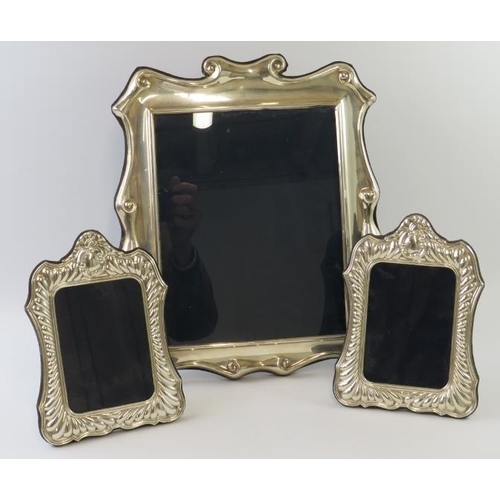 418 - Three late 20th century silver mounted photo frames, each fully hallmarked. All with blue velvet eas... 