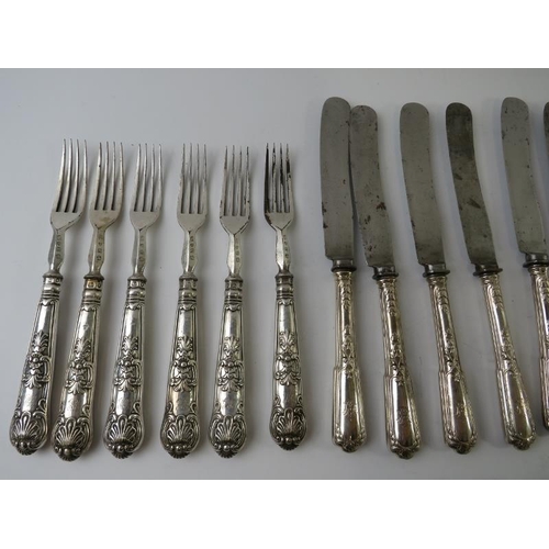 425 - A quantity of antique silver handled cutlery of various patterns and age.  Bearing English hallmarks... 