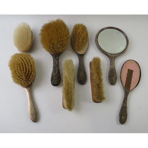 431 - A five piece silver and tortoiseshell backed vanity set including mirror and four brushes, and three... 