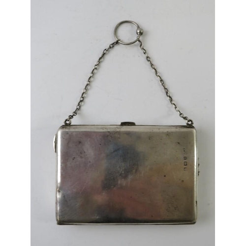 435 - An early 20th century silver combination purse and card case with interior green satin dividers, hal... 