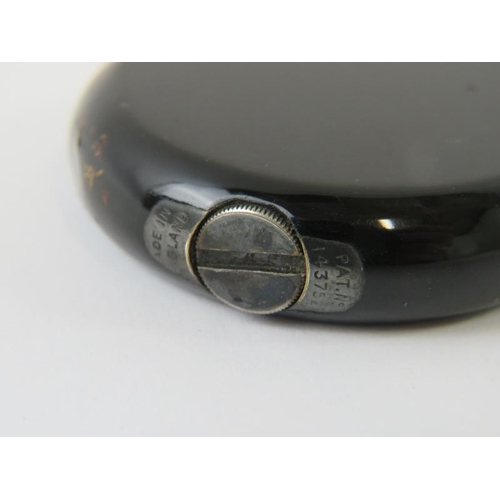 441 - A very rare black enamelled Dunhill swing arm cigarette lighter, probably by Namaki. Black circular ... 