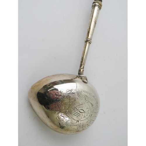 448 - A fine George II silver toddy ladle with turned hard wood handled and engraved bowl. Overall length ... 