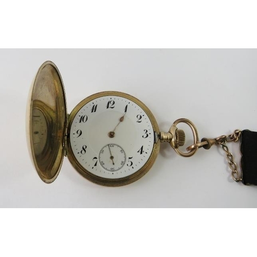 453 - A gold plated Junghans full hunter pocket watch with seconds count wheel, engine engraved case, seri... 