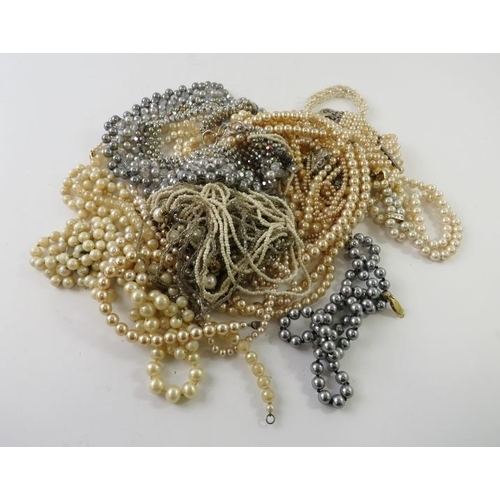 465 - A large quantity of faux pearl necklaces to include chokers, collars, strands etc, 900g gross approx