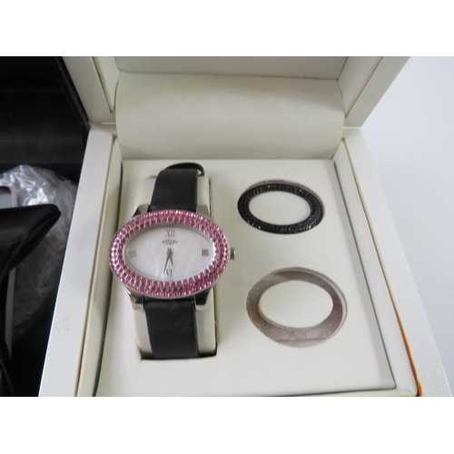 470 - Rotary: a ladies wristwatch with interchangeable bezel, boxed; and a ladies Guess white metal wristw... 