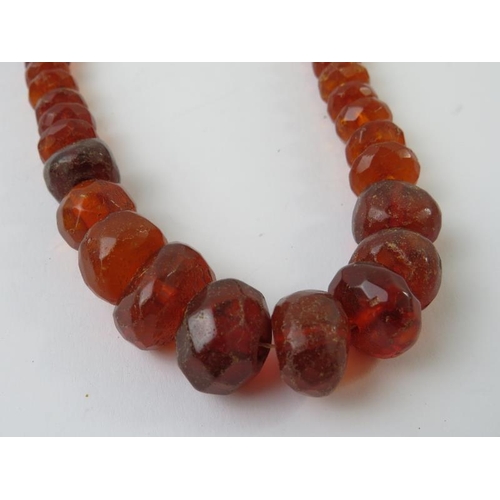 490 - A copal resin faceted bead necklace, 420mm long, 36gms approx 
Condition report: beads chipped and f... 