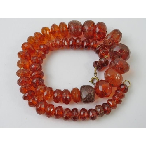 490 - A copal resin faceted bead necklace, 420mm long, 36gms approx 
Condition report: beads chipped and f... 