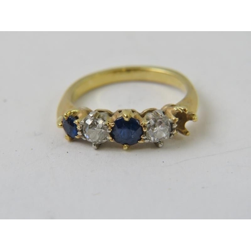 491 - A precious yellow metal sapphire and diamond half-hoop ring, with two round old cut diamonds and two... 