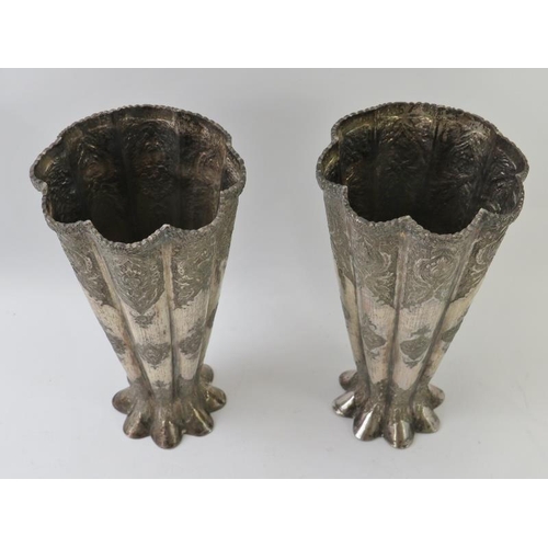 494 - A Pair of Eastern white metal fluted vase, each with intricate chased patterns and Eastern marks to ... 