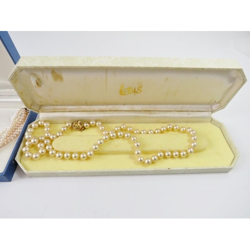 498 - A two strand freshwater pearl necklace; and other faux pearl necklaces and a pair of screw back earr... 