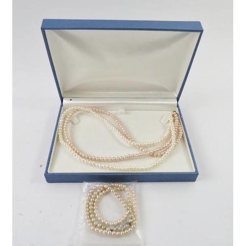 498 - A two strand freshwater pearl necklace; and other faux pearl necklaces and a pair of screw back earr... 