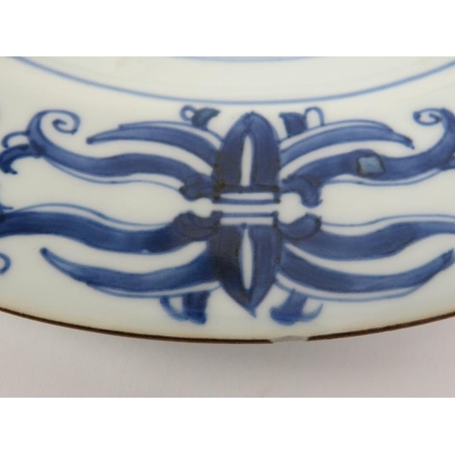 50 - Two Chinese blue and white porcelain plates, early/mid 18th century. Unusually decorated with vajra ... 