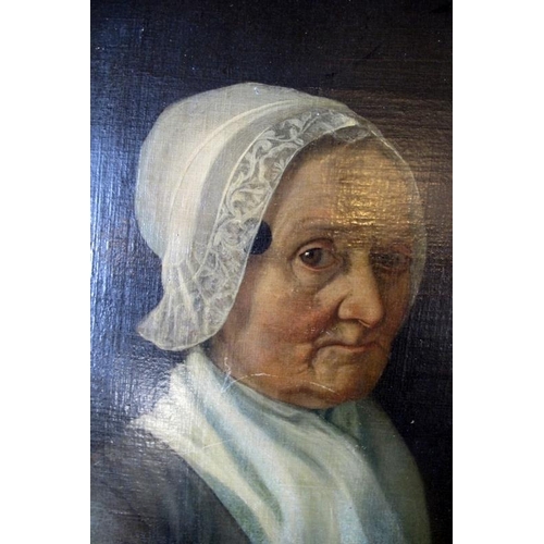 512 - A 19th Century oval mounted oil on canvas portrait study of an elder woman wearing a lace rimmed bon... 