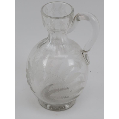 53 - A group of glassware items, 20th century. Comprising two vases, a jug engraved with fern leaves and ... 