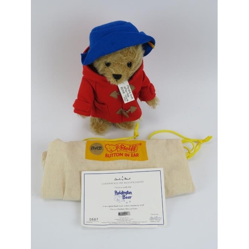 57 - A Steiff Danbury Mint exclusive Paddington Bear. With buttoned yellow tag (070051), wearing a blue f... 