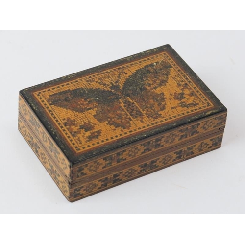 97 - A Tunbridge Ware miniature box decorated with a butterfly mosaic to the cover. 7.1 cm length.
Condit... 