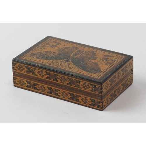 97 - A Tunbridge Ware miniature box decorated with a butterfly mosaic to the cover. 7.1 cm length.
Condit... 