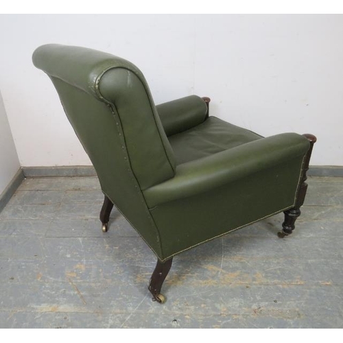 701 - A good 19th century oak library chair, reupholstered in juniper green leather with brass studs, the ... 