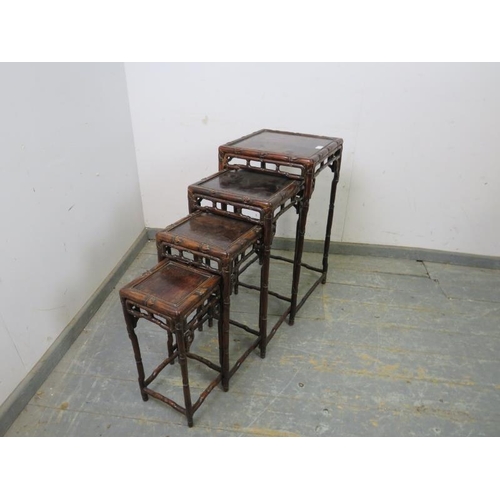 710 - A set of four antique Chinese hardwood nesting tables, having carved and pierced frieze modelled as ... 