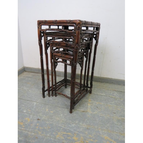 710 - A set of four antique Chinese hardwood nesting tables, having carved and pierced frieze modelled as ... 