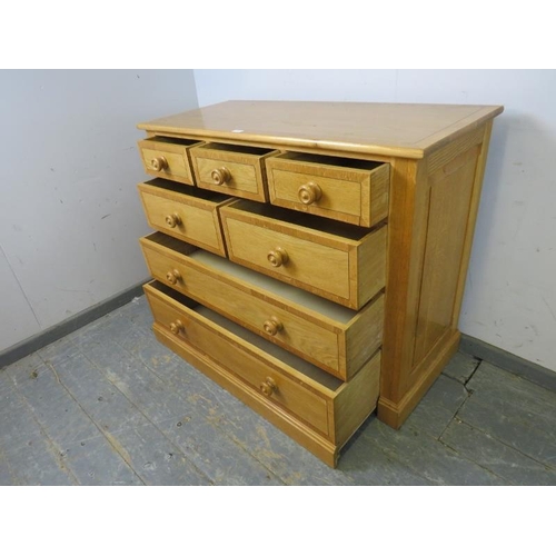 716 - A bespoke antique style light oak chest, crossbanded and strung with mahogany, housing five short an... 