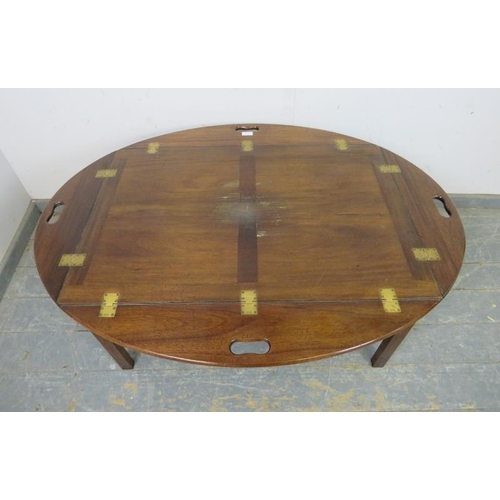 717 - A large vintage mahogany coffee table/butler’s tray in the Georgian taste, the folding sides with pi... 