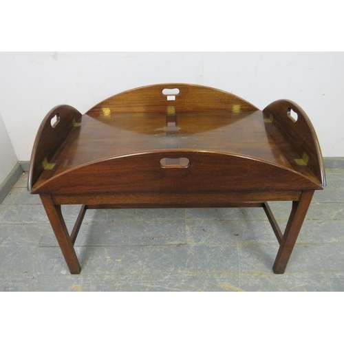 717 - A large vintage mahogany coffee table/butler’s tray in the Georgian taste, the folding sides with pi... 