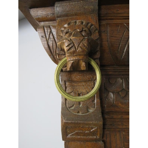 719 - A large 19th century dressing mirror, the sectioned and bevelled plates within a carved oak surround... 