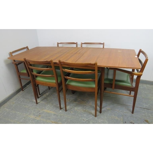 721 - A mid-century teak extending dining table by McIntosh, to match previous lot, with butterfly folding... 