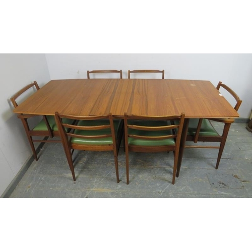 721 - A mid-century teak extending dining table by McIntosh, to match previous lot, with butterfly folding... 