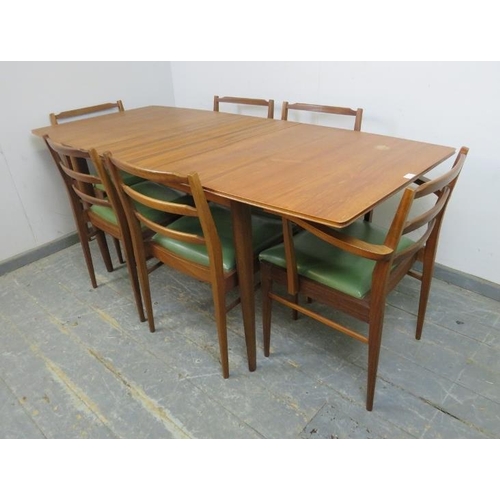 721 - A mid-century teak extending dining table by McIntosh, to match previous lot, with butterfly folding... 