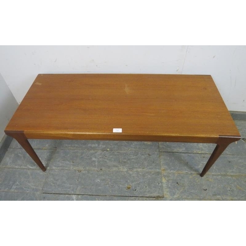 722 - A mid-century teak rectangular coffee table by McIntosh, on tapered supports. 
H42cm W105cm D45cm ap... 