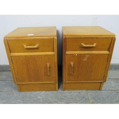 725 - A pair of mid-century light oak G-Plan ‘Brandon’ bedside cabinets, each housing one long drawer with... 