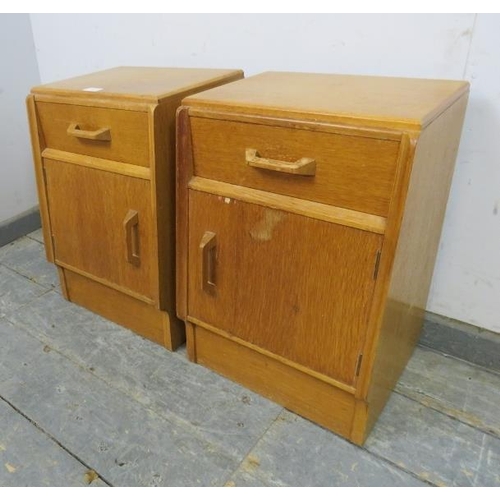 725 - A pair of mid-century light oak G-Plan ‘Brandon’ bedside cabinets, each housing one long drawer with... 