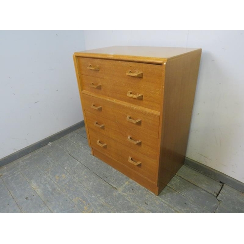 726 - A mid-century light oak G-Plan ‘Brandon’ chest, housing five long graduated drawers, on a plinth bas... 