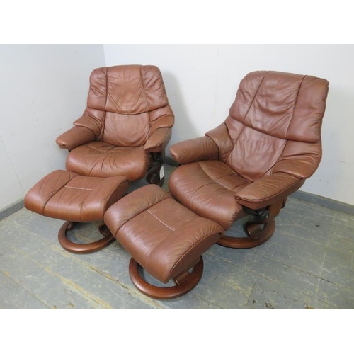 730 - A pair of brown leather ‘Stressless’ reclining lounge chairs by Ekornes, on swivelling circular plin... 