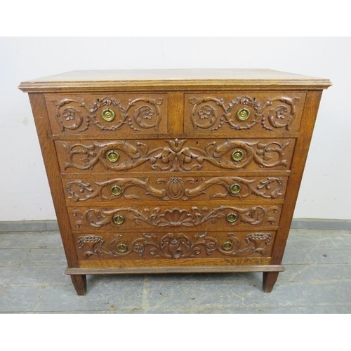 740 - An artisan made vintage oak chest, profusely carved in hight relief with Classical motifs including ... 