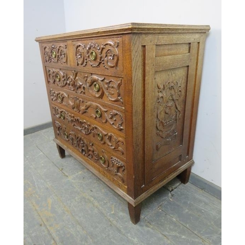 740 - An artisan made vintage oak chest, profusely carved in hight relief with Classical motifs including ... 