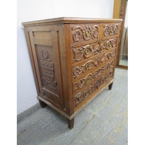 740 - An artisan made vintage oak chest, profusely carved in hight relief with Classical motifs including ... 