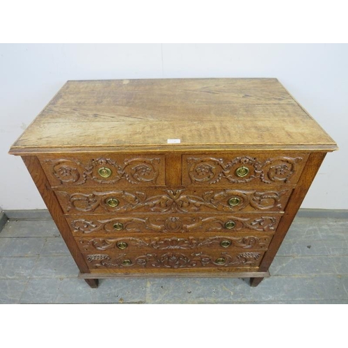 740 - An artisan made vintage oak chest, profusely carved in hight relief with Classical motifs including ... 