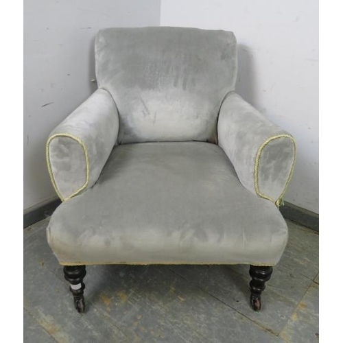 741 - A small 19th century club armchair, reupholstered in grey velvet with gold braid trim, on ebonised t... 