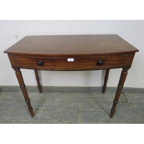 745 - A George IV mahogany bow-fronted hall table, housing one long cock-beaded, oak-lined drawer with tur... 