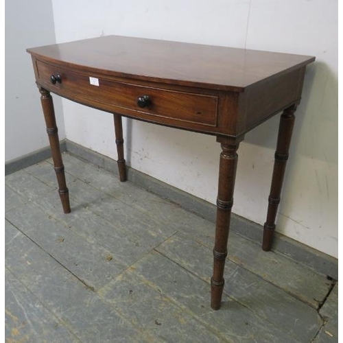 745 - A George IV mahogany bow-fronted hall table, housing one long cock-beaded, oak-lined drawer with tur... 